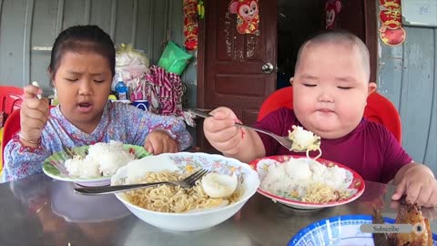 Baby Eating rice with noodle