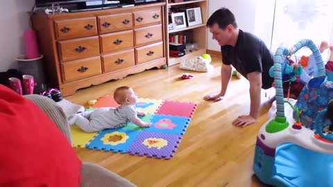 Funny moments of baby exercising with daddy