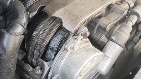 Damaged automobile engine running automobile engine