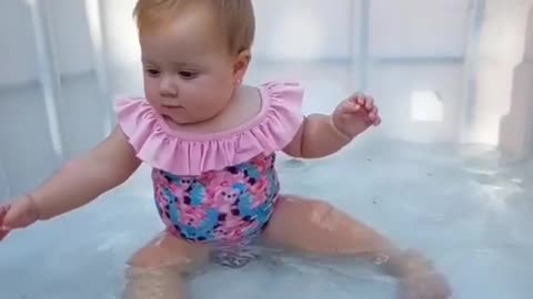 Cute baby girl enjoy pool party