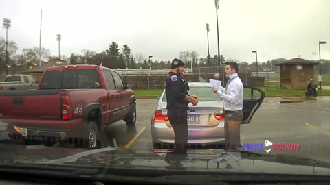 Dashcam Police Officer Helps Speeding Student Tie His Tie