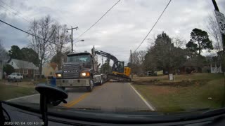 Awkward Excavator Loading Attempt Ends in Fall