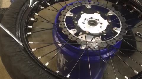 Mounting ice racing tires.