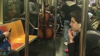 Latin band plays with bass in subway