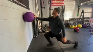 Exercise Technique #4 Medicine Ball: Stacked 1 Arm Wall Lunge
