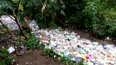 Plastic Waste Floats Free Polluting A River In Guatemala