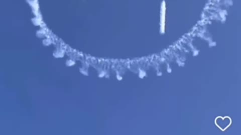 Chemtrails with smiley faces in the air.