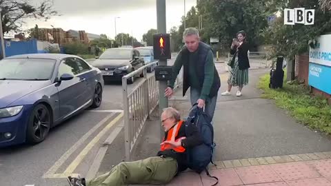 Enraged drivers starting to drag eco-mob activists off the road because they have to go to work