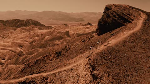 Astronaut walking downhill