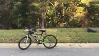 Face plant man falls forward after riding bike over ramp on sidewalk