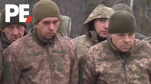 Ukrainian POWs are marched by pro-Russian