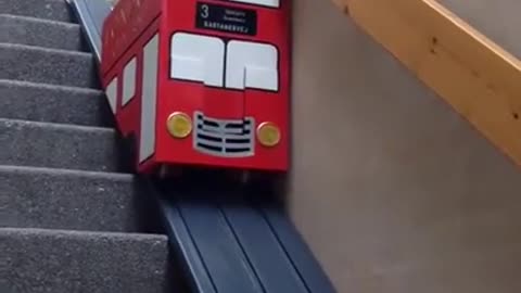 Cute dog takes the London Bus stair lift. Does he have a ticket? very smart he cute puppy