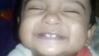 Cute baby girl gets super excited for showing her teeth
