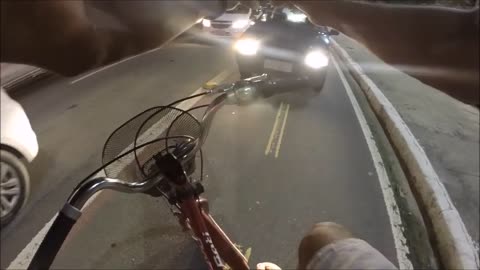 Cyclist Stops a Car from Crossing Over Bike Path