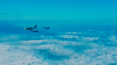 Alenia C-27J escored by jetfighters