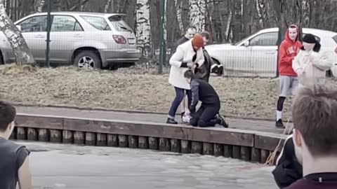 This man is risking his own life to save a drowning dog