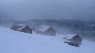 A winter storm with three houses