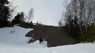 Red board snowboard hits rocks
