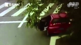 Shocking moment two-year-old is flung from moving car onto the road