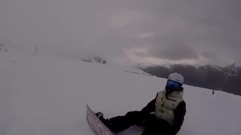 Grey snowboarder hits filmer skier