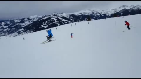 Guy blue jacket skiing falls plummets
