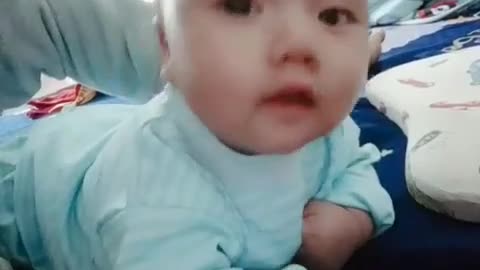 2-month-old baby is learning to crawl