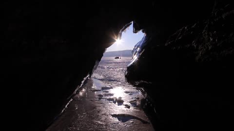 View of a Frozen Lake through Natural Stone Cave | so beautiful