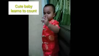 Cute baby learns to count