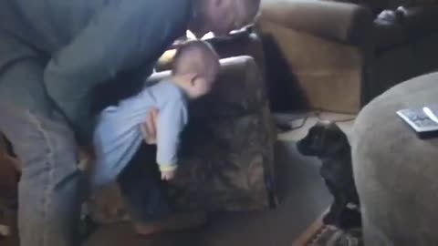 Baby laughs hysterically at rambunctious puppy
