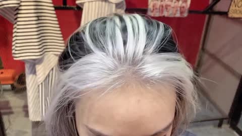 amazed at the beauty of her hair after being dyed