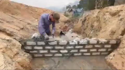 Building a water dam with bare hands.