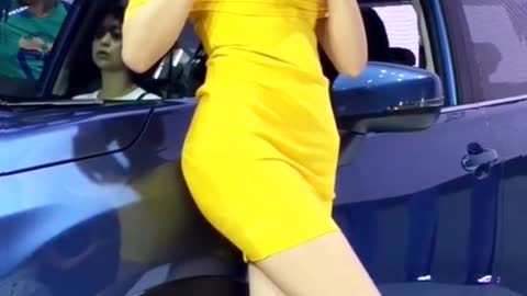 Model with a great figure in a yellow dress