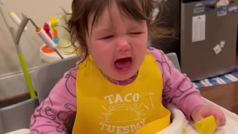 Toddler gives confusing reaction after tasting a lemon