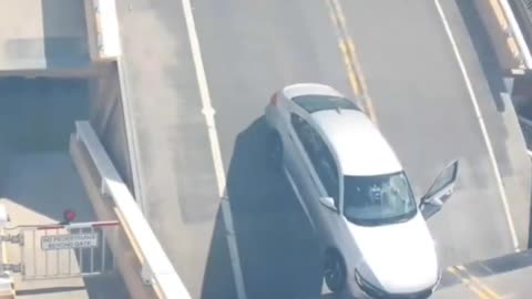 Man gets stuck on rising lift bridge