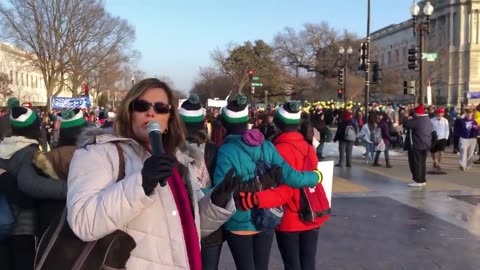 Donica Hudson reports across the street from the Supreme Court