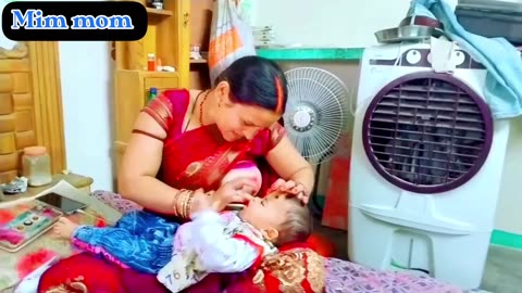 Beautiful mom and baby breastfeeding Indian nice mom