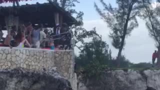 Insane cliff diver risks all for jump