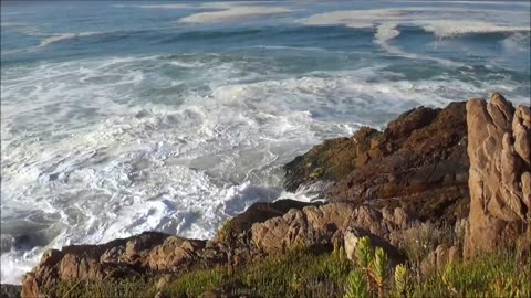 Oceans waves crashing on rock