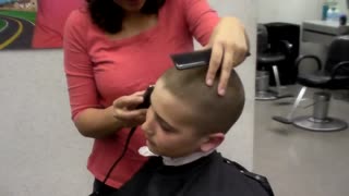 Girl headshave at salon