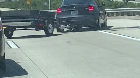 Telsa with Trailer Loses Control