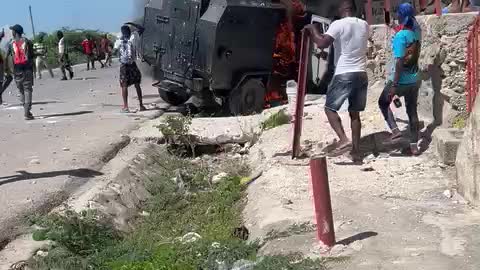 Port au Prince Gangs destroy police armored car