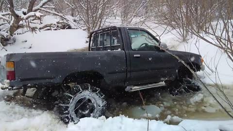 Toyota Hilux Pickup in the snowy swamp