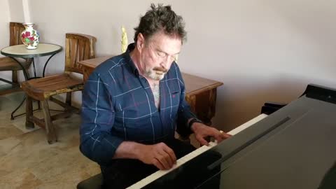 John McAfee on piano.