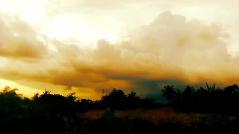 Video of clouds moving over time in the evening sky