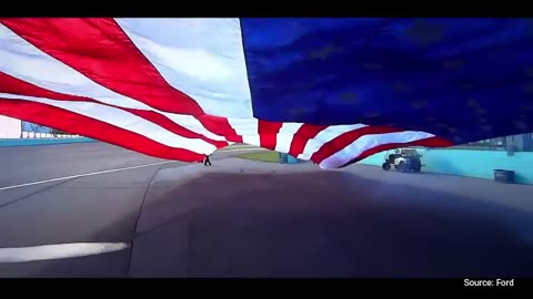 WATCH: Ford Trucks Pull Giant American Flags As Mustangs Race Underneath