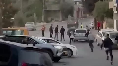 Dozens of young men throw stones at Israeli forces in Ramallah