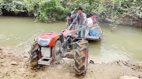 #79-driver tractor go transport water at the river