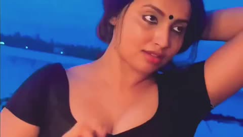 Black blouse showing cleavage and navel hot heroine