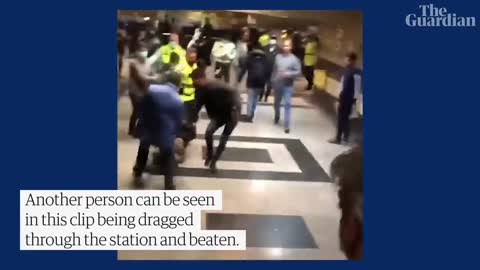 People run for cover as Iranian police open fire during protest at Tehran metro station