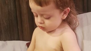 Child Struggles to Choose Between Sleep and Snacks